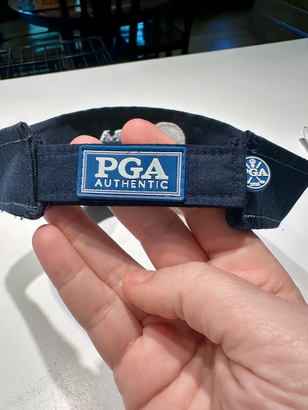 PGA Tour Navy and White Visor with Gold Logo